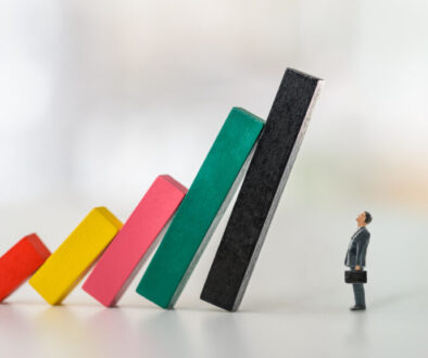 Company financial risk and escape methods, business strategy concept : Businessman CEO looks at collapsed bar graphs in a situation that needs prompt action. Leader / Manager confronts tough problems Company financial risk and escape methods, business strategy concept : Businessman CEO looks at collapsed bar graphs in a situation that needs prompt action. Leader / Manager confronts tough problems